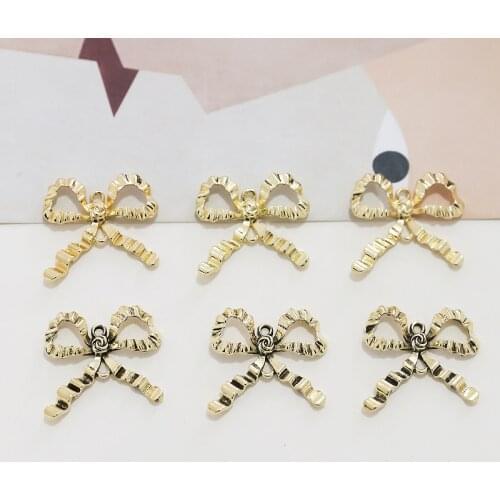 Simple gold covered pleated hollow bow ancient gold double hanging pendant DIY hand made Earrings material accessories