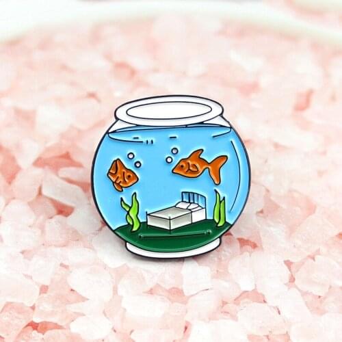 There are seaweed in the fish tank with water and two small goldfish brooch to give children a denim underwear accessories plant