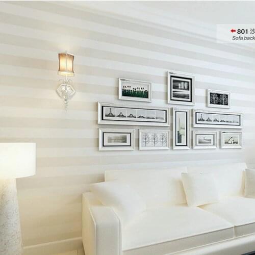 Modern simple non-woven wallpaper vertical stripe rice white beige wallpaper living room bedroom hotel plain color