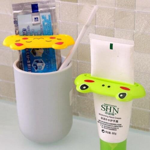 1PC HOT Bathroom Home Tube Rolling Holder Squeezer Easy Cartoon Toothpaste Dispenser 2018 Color Random