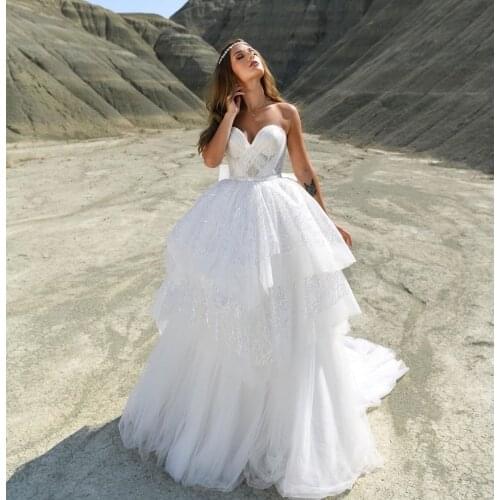 Dreamy Princess Wedding Dress 2021 Sweetheart Lace Sequins Bow Backless Sleeveless Tiered Sweep Train Bride Gown Robe De Mariée