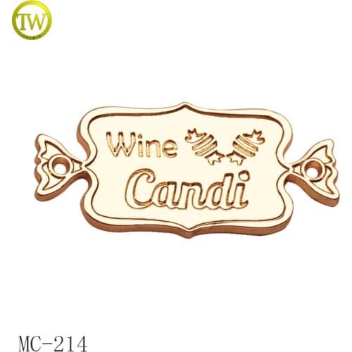 Fashion candy logo embossed garment metal label custom clothing tag