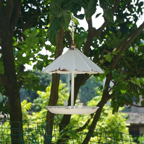 Retro vintage rusty metal hanging bird feeders