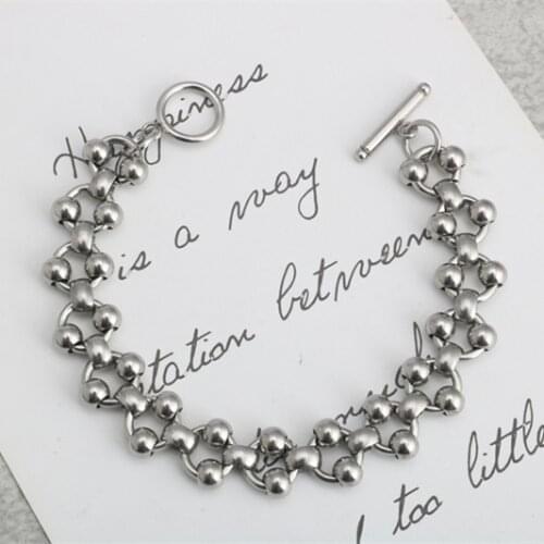 Fashion fancy OT buckle round bead hip hop stainless steel O word men and women titanium steel word buckle bracelet hot sale