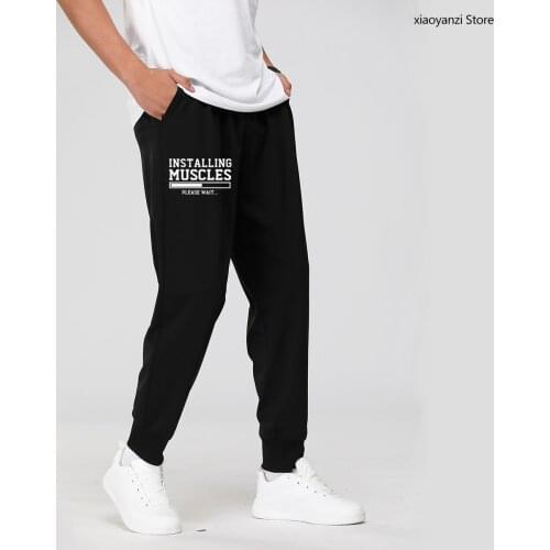 Mens 2021 Spring Autumn printed INSTALLING MUSCLES funny Sweatpants fashion brand clothing cross Sports Long Pants Trousers