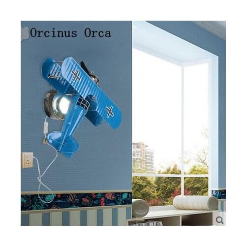 Creative Retro Blue plane wall lamp Boys bedroom bedside lamp Childrens room wall lamp Cartoon LED iron fighter wall lamp