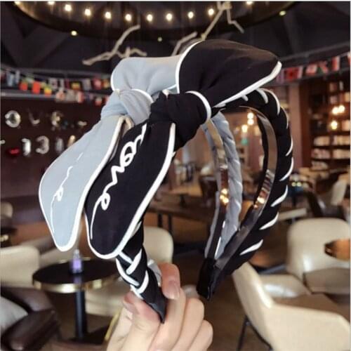 South Koreas new high-end fashion Love letter print bow braided hair hairband headband hair accessories Korean cloth ladies