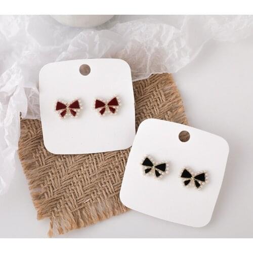 U-Magical Exquisite Cute Bowknot Dangle Earrings for Women Fashion Pearl Small Red Black Metallic Earrings Jewelry Pendientes
