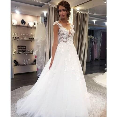 White Wedding Dresses Lace Applique A Line Sleeveless Illusion Sweep Train Bridal Gown Dress with Back Buttons Robe De Mariage