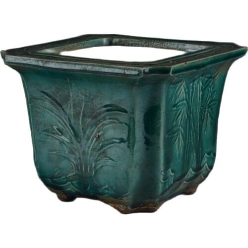 The early collection of late Qing Dynasty kiln monochrome glaze, green glaze carved square pattern flower pot