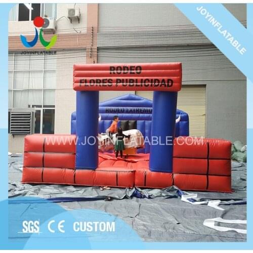 Cheap funny outdoor inflatable mechanical cowboy riding rodeo bull with inflatable mat