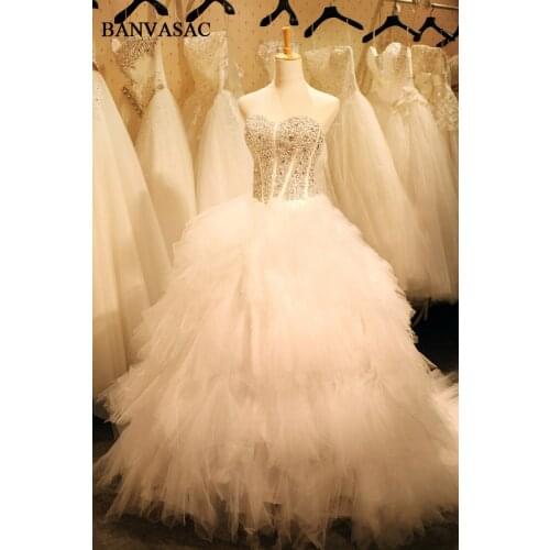 BANVASAC 2018 Strapless Feathers Plus Size Ball Gown Wedding Dresses Real Photos Luxury Crystals Beadings Bridal Dresses