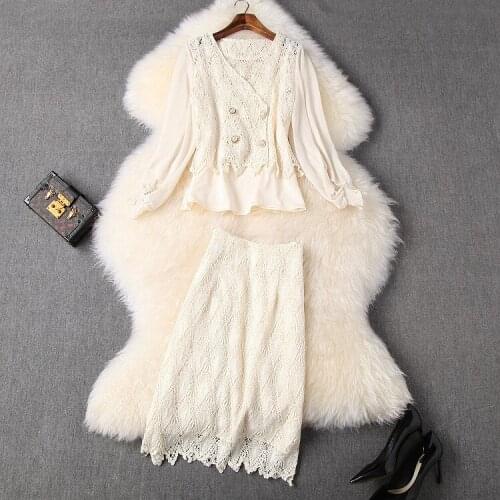 In the spring of 2021 in Europe and the United States beauty women wear hollow-out long-sleeved shirt skirt fashion suits