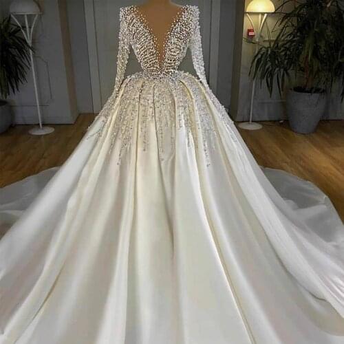 Deep V-neck Long Sleeve Princess Ball Gown Wedding Dress Pearls Beaded Dubai Satin Bridal Gown