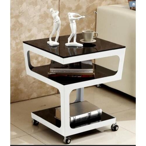 Simple modern sofa corner. Metal tempered glass multi-layer white edge table. Small tea table