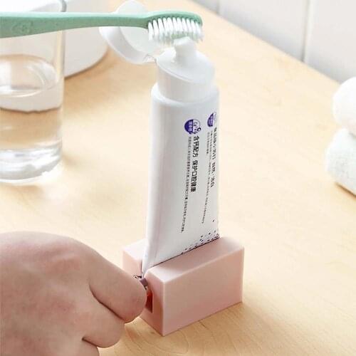 Creative Toothpaste Dispenser Squeezer Plastic Cream Tube Squeezing Dispenser Rolling Tube Squeezer Bathroom Accessories