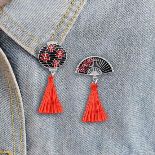 Four red flowers embellished with lanterns a red plum dotted with a folding fan Fashion personality tassel national wind brooch