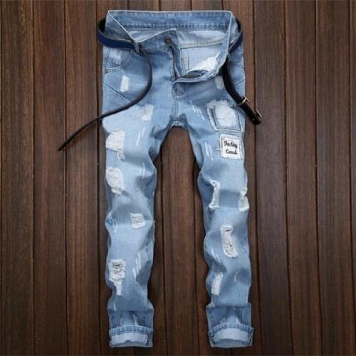 New style mens slim-fitting small-foot trousers mens frayed patched trousers fashion light blue hipster male beggar trousers