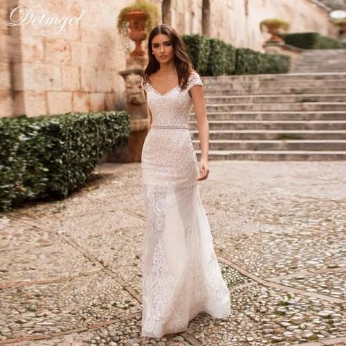 Detmgel Sexy Scoop Neck Button Mermaid Wedding Dresses 2021 Luxury Beaded Appliques Satin Brush Train Princess Wedding Gown