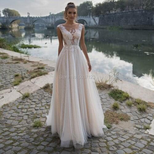 2021 Beach Wedding Dresses A Line Tulle V Neck Cap Sleeves Floor Length Open Back Vestido De Noiva Bridal Wedding Gown Plus Size