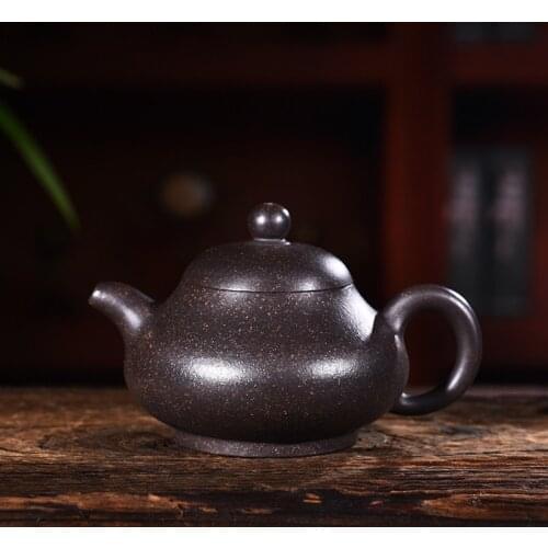 Quality goods all hand undressed ore black mud zhu yu milk pot ball hole kung fu tea set wholesale the teapot