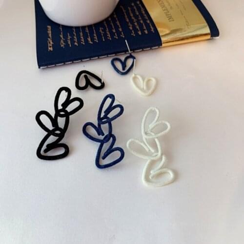 U-Magical Asymmetry Black White Soft Plush Love Heart Earrings for Women Temperament Hollow Metallic Earrings Jewelry Pendientes