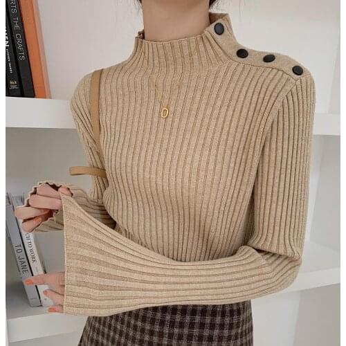 Women knitting sweater with half high neck design and shoulder button backing