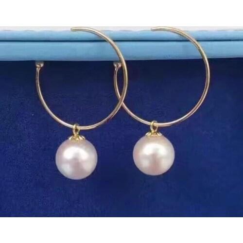 Charming pair of 10-11mm round south sea white pearl earring yellow gold