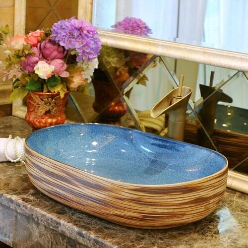 Oval Artistic Handmade Sapphire blue lotus carving Ceramic wash basin Round Counter top wash basin art ceramic bathroom sinks