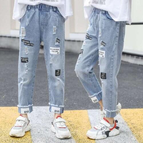Girls' childrens clothing spring and autumn tattered jeans summer loose childrens pants big girls' fashion casual pants 2-13Y