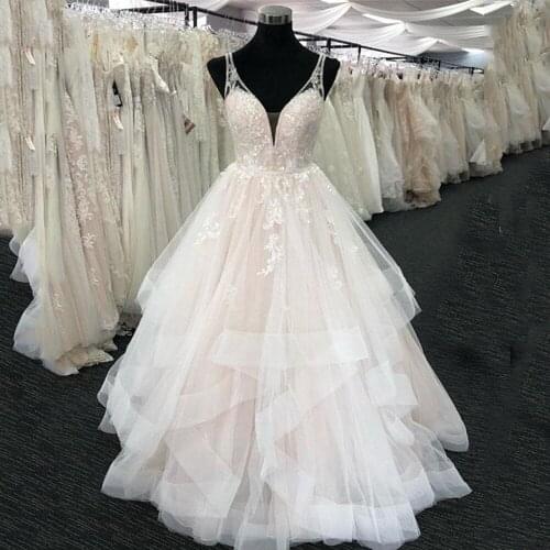 Blush Pink Wedding Dresses 2021 V Neck Luxury Beaded Lace Ruffled Tulle A Line Bridal Gowns Criss Cross Back