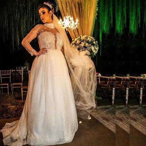 Luxury Bead Top A Line Wedding Dresses Squined Skirt Long Sleeve Bohemian Bridal Gown See Through Back Wedding Gowns