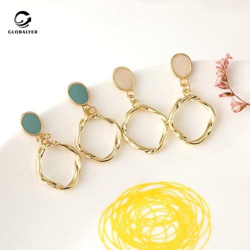 Tibetan Silver needle Korean style temperament simple twist flower earrings Hollow metal circle irregular cold wind earrings 202