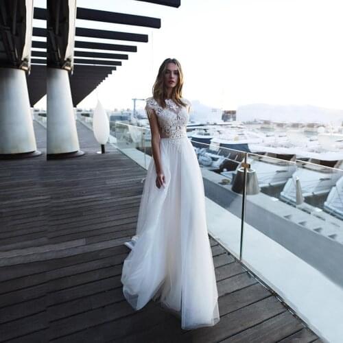 Charming Summer Beach Lace Backless Bridal Wedding Dresses Cap Sleeves Beaded Bateau Neckline Wedding Gowns for Bride Appliqued