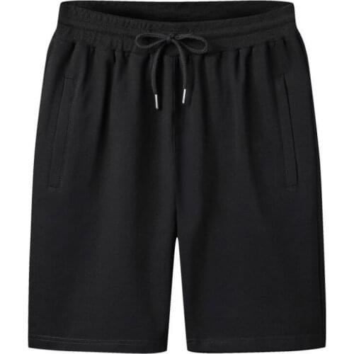 Pure color casual shorts male youth cotton sports shorts pants casual Korean five-point pants mens beach pants