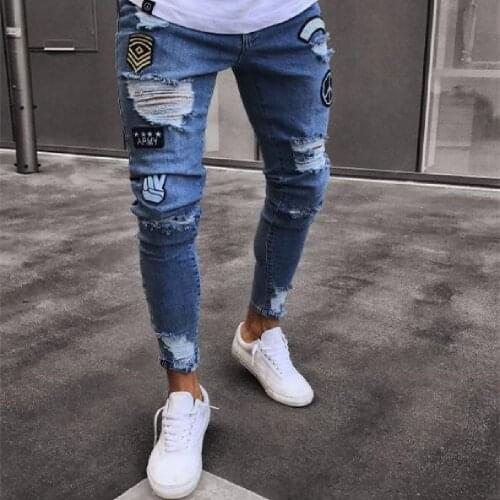 Mans jeans European and American fashion Personality trend badge jeans hip-hop street thin holes wear white tight skinny pants