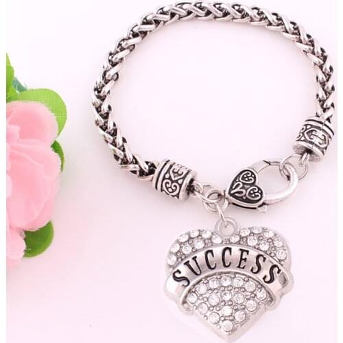 Rhodium plated studded with rhinestone SUCCESS heart pendant bracelet