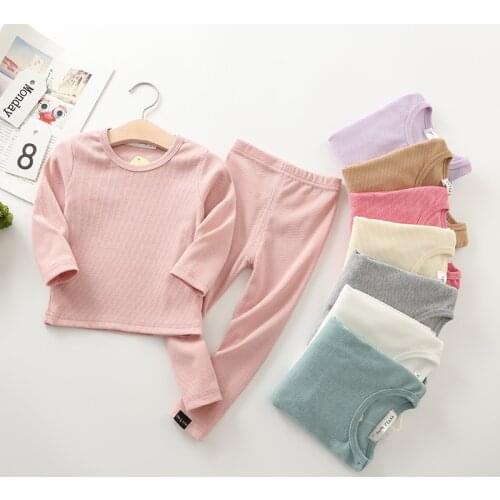 2021 new childrens solid color home clothes boys and girls candy color pajamas elastic warm long sleeve T-shirt pants two piece
