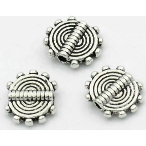 DoreenBeads Spacer Beads Round Silver Color Stripe Carved 10x8.5mm,100PCs (B22471), yiwu