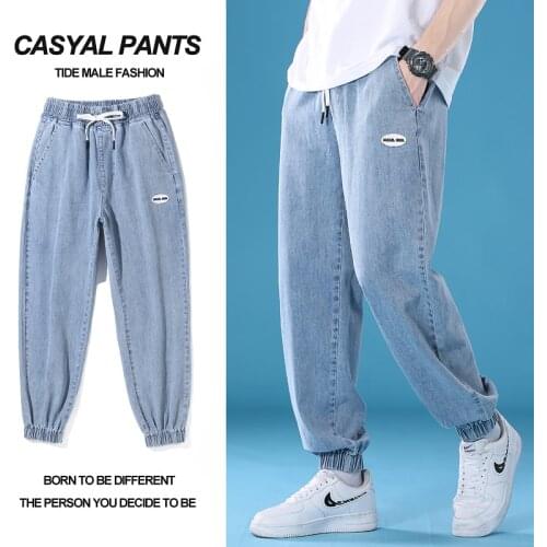 New young mens loose casual harem jeans solid color large size lace-up trousers fashion trend cropped trousers
