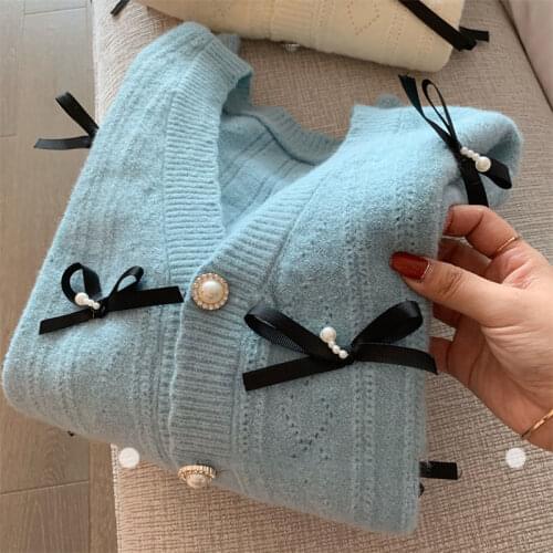 Bowknot V-neck sweater 2021 autumn and winter fashion new long-sleeved single-breasted pure color knitted cardigan jacket women