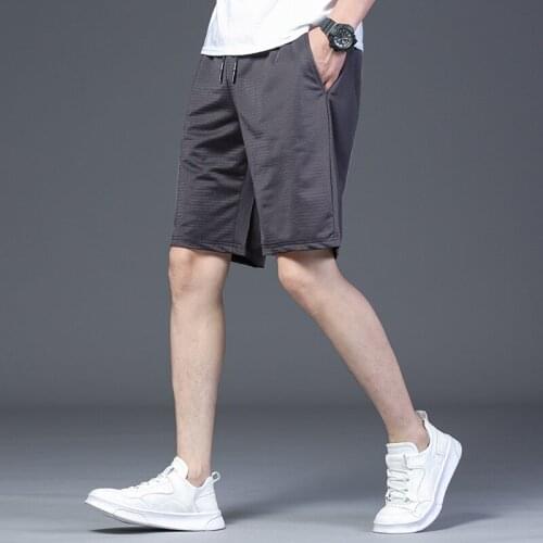Mens shorts youth fashion casual ice silk mesh air-conditioning pants summer thin section breathable five-point beach pants