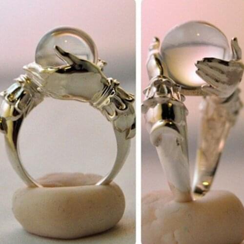 Hand holding gem-shaped couple ring creative Fashion female ring for woman