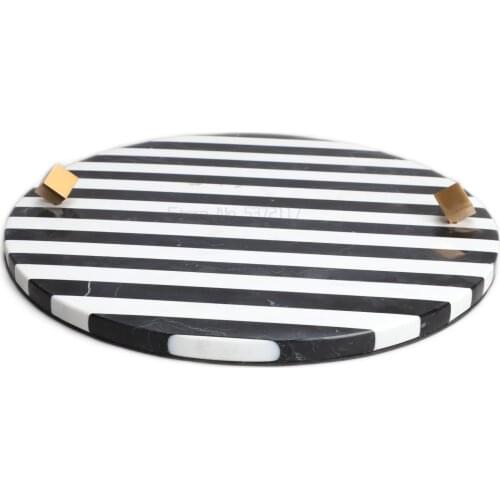 Black and white striped marble round tray decorated with wine utensils tray
