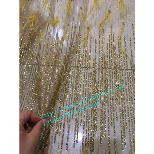 Wholesale african embroidered glued glitter lace fabric with sequins for wedding dress swiss french tulle lace with feather