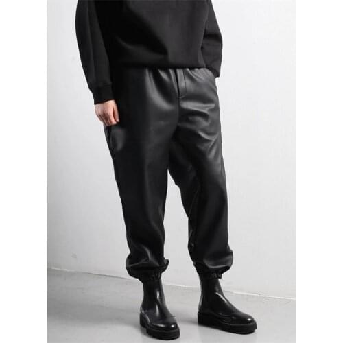 Mens pants loose large new fashion trend versatile casual solid color tapered leather strap back pocket elastic pants