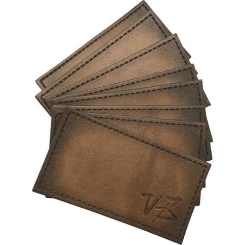 Custom Clothing Leather Labels For Jeans Brand Logo Sewing Labels Pu Leather Embossed Logo Label For Clothes Name Price Tags