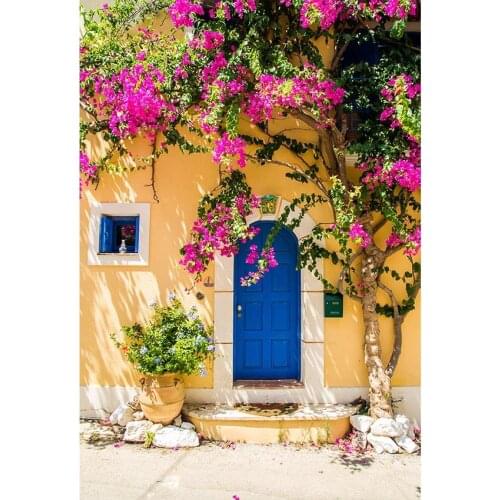 Small Town Scenery Photography Background House With Yellow Wall And Blue Door Stone Floor With Pink And Blue Flowers Backdrop