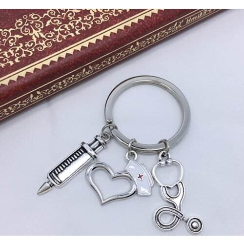 Peach heart-shaped nurse cap Medical key chain Syringe syringe Stethoscope key chain