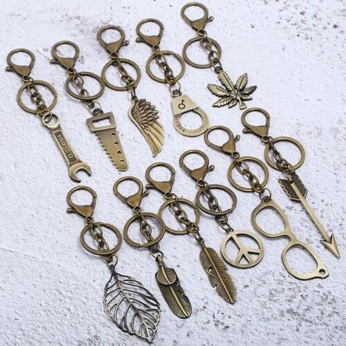 Fashion Punk Vintage Alloy Bronze Key Chain Metal Peace Arrow Feather Leaf Charm Bag Car Keychain Keyring Retro Accessories Gift